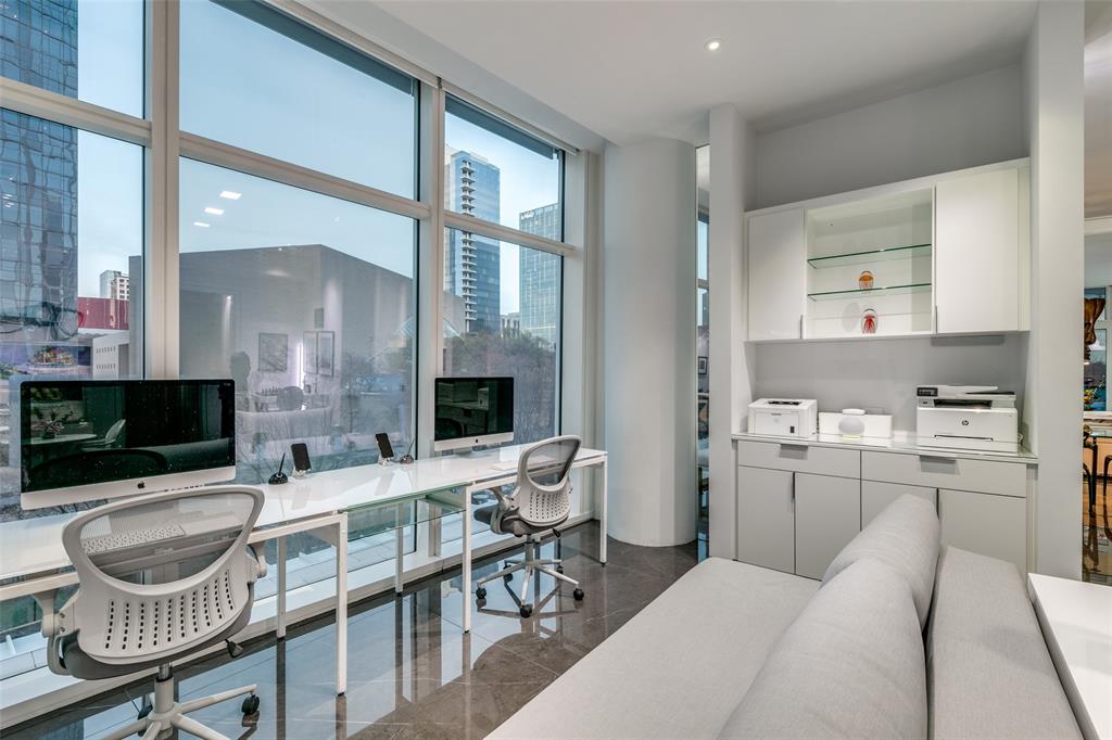 1918 Olive Street, Unit 202 Dallas, TX 75201 - Photo 11 of 36 a living room with furniture a flat screen tv and a fireplace
