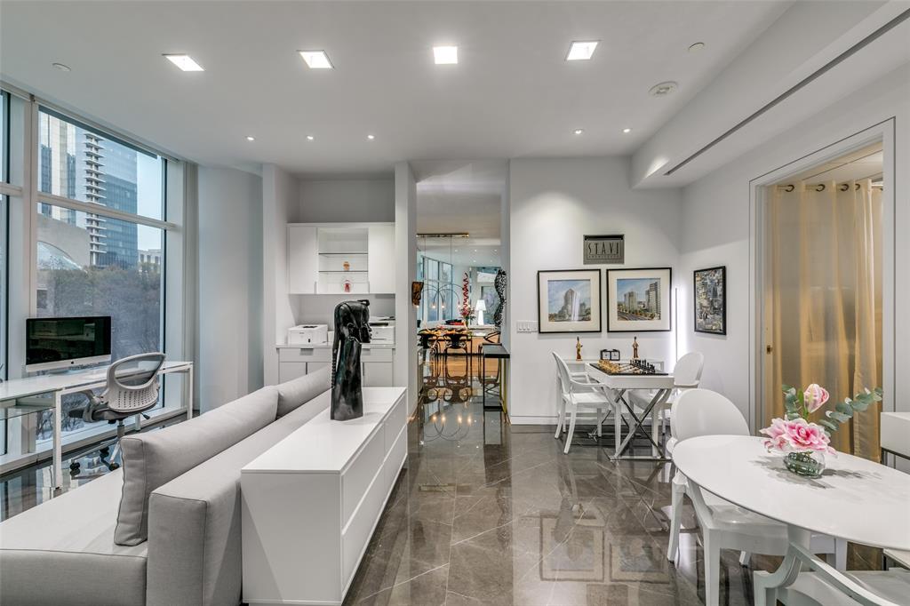 1918 Olive Street, Unit 202 Dallas, TX 75201 - Photo 12 of 36 a living room with furniture and flat screen tv