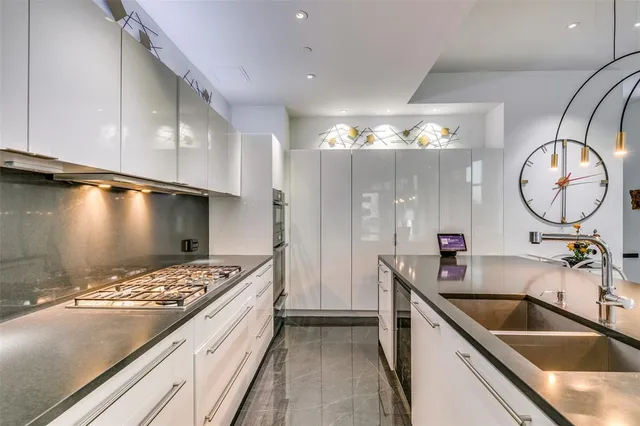 a kitchen with a sink and a stove