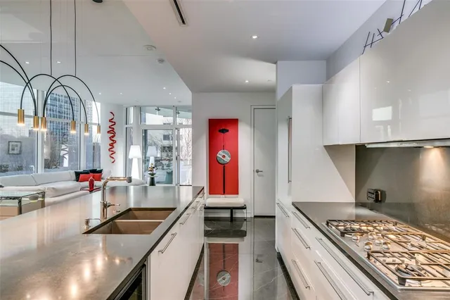 a kitchen with stainless steel appliances granite countertop a stove and a sink