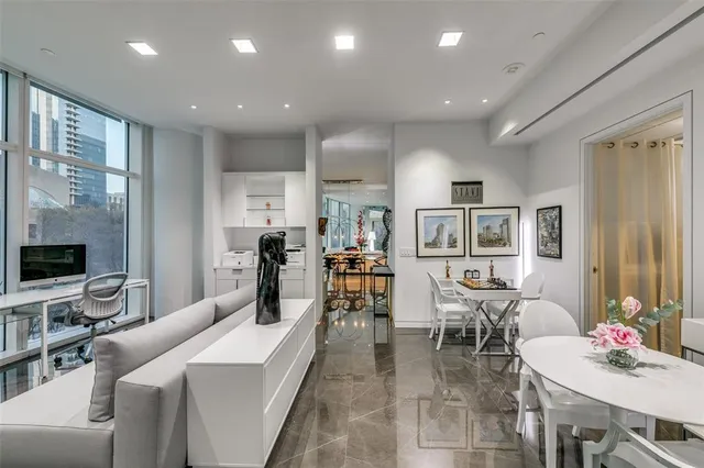 a living room with furniture and flat screen tv