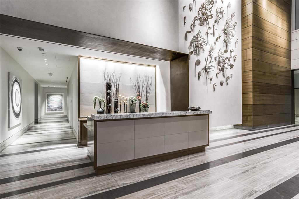 1918 Olive Street, Unit 202 Dallas, TX 75201 - Photo 28 of 36 a living room with a large window and wooden floor
