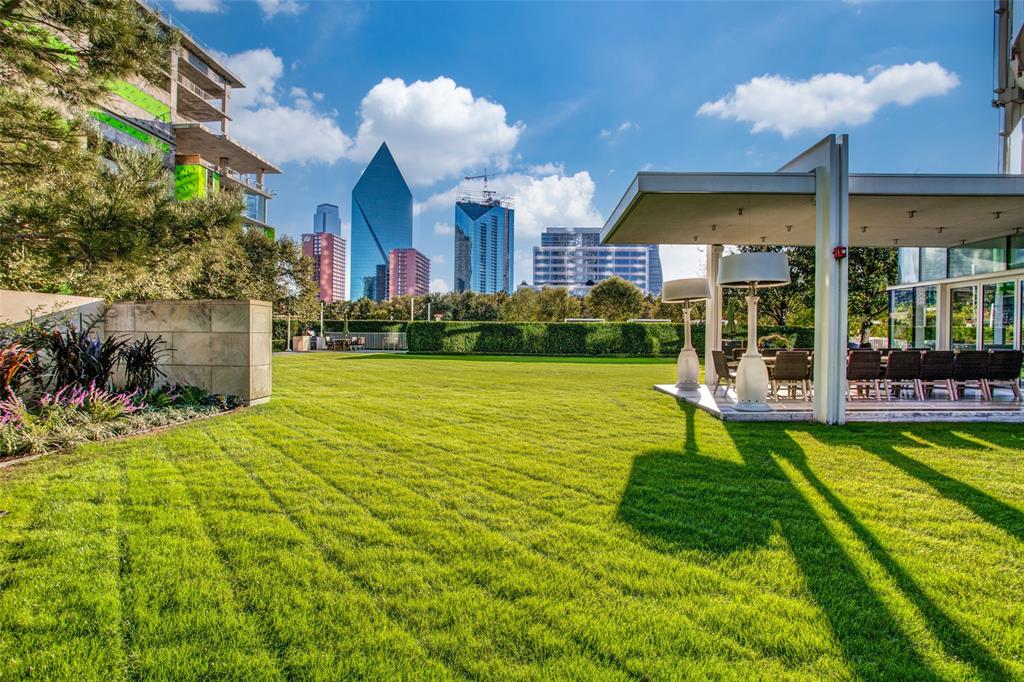 1918 Olive Street, Unit 202 Dallas, TX 75201 - Photo 31 of 36 a view of a house with a yard and plants
