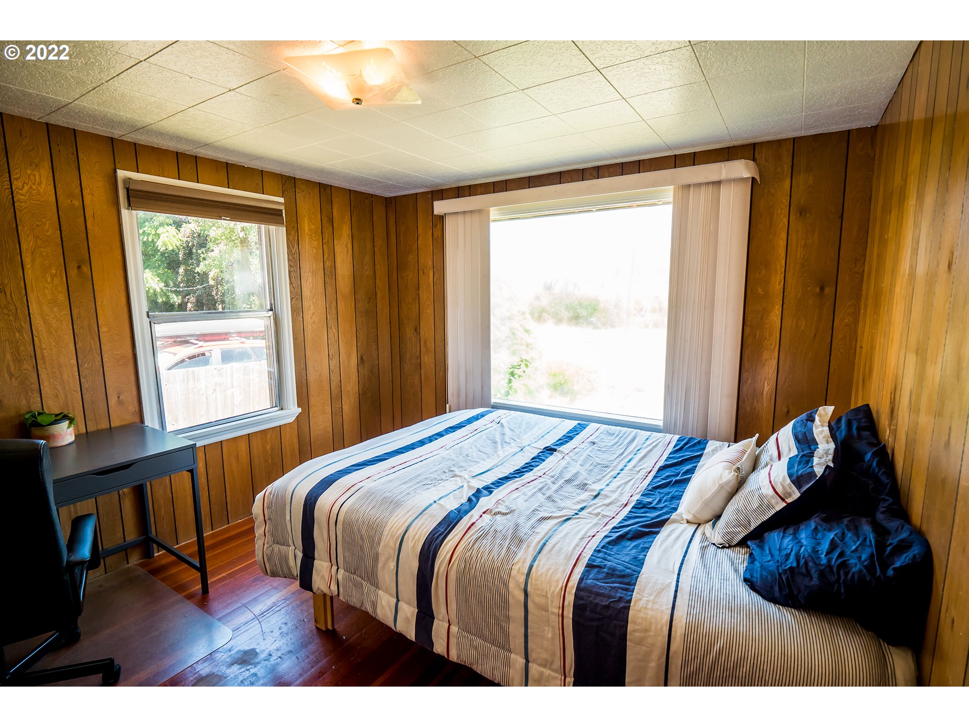 1648 Augusta Street Eugene, OR 97403 - Photo 12 of 29 a bedroom with a bed and a window