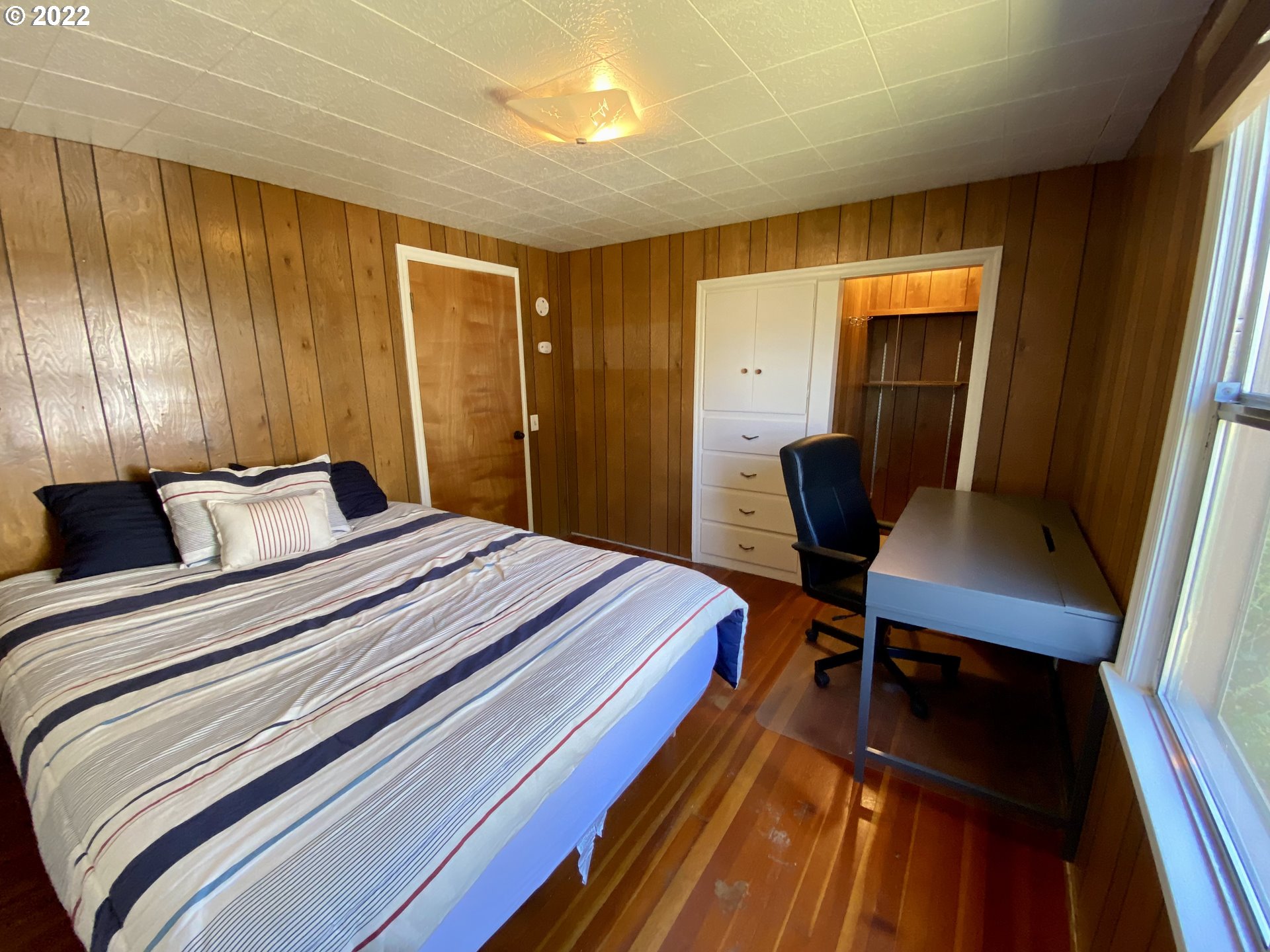 1648 Augusta Street Eugene, OR 97403 - Photo 13 of 29 a bedroom with a bed and a furniture