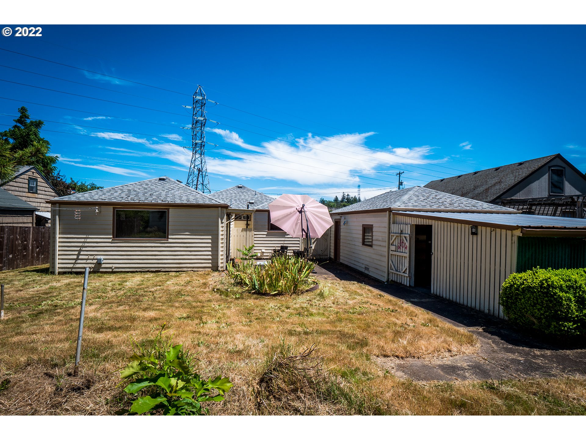 1648 Augusta Street Eugene, OR 97403 - Photo 18 of 29 a view of a backyard of a house with a garage