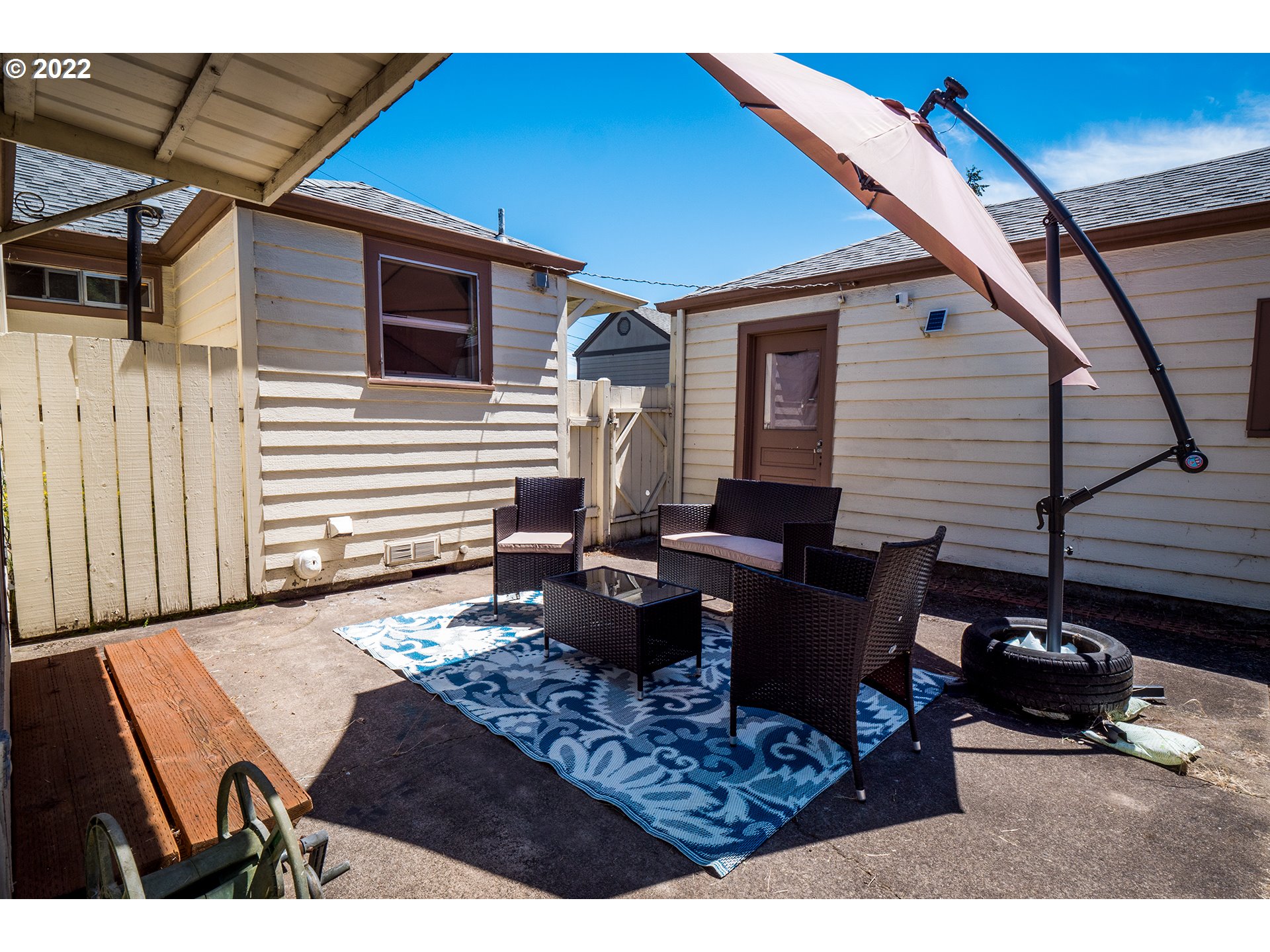 1648 Augusta Street Eugene, OR 97403 - Photo 19 of 29 a view of a patio with couches table and chairs and potted plants