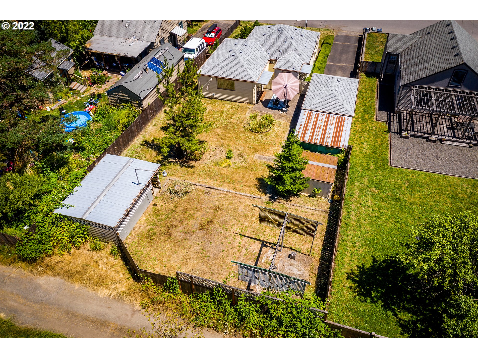 1648 Augusta Street Eugene, OR 97403 - Photo 21 of 29 an aerial view of a house with a yard and garden