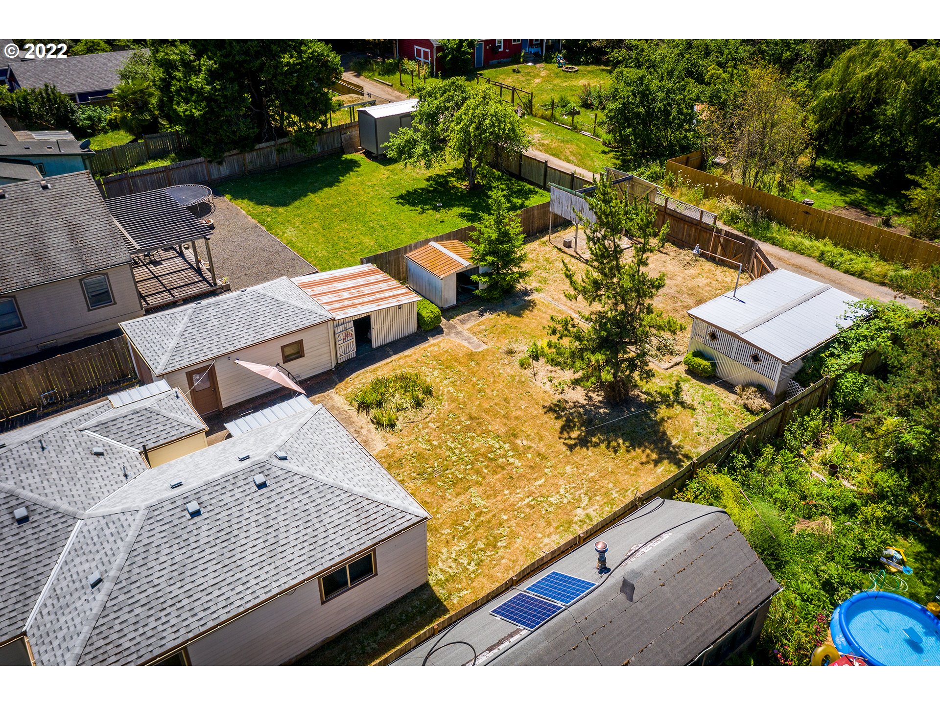 1648 Augusta Street Eugene, OR 97403 - Photo 24 of 29 an aerial view of a house with a garden and lake view