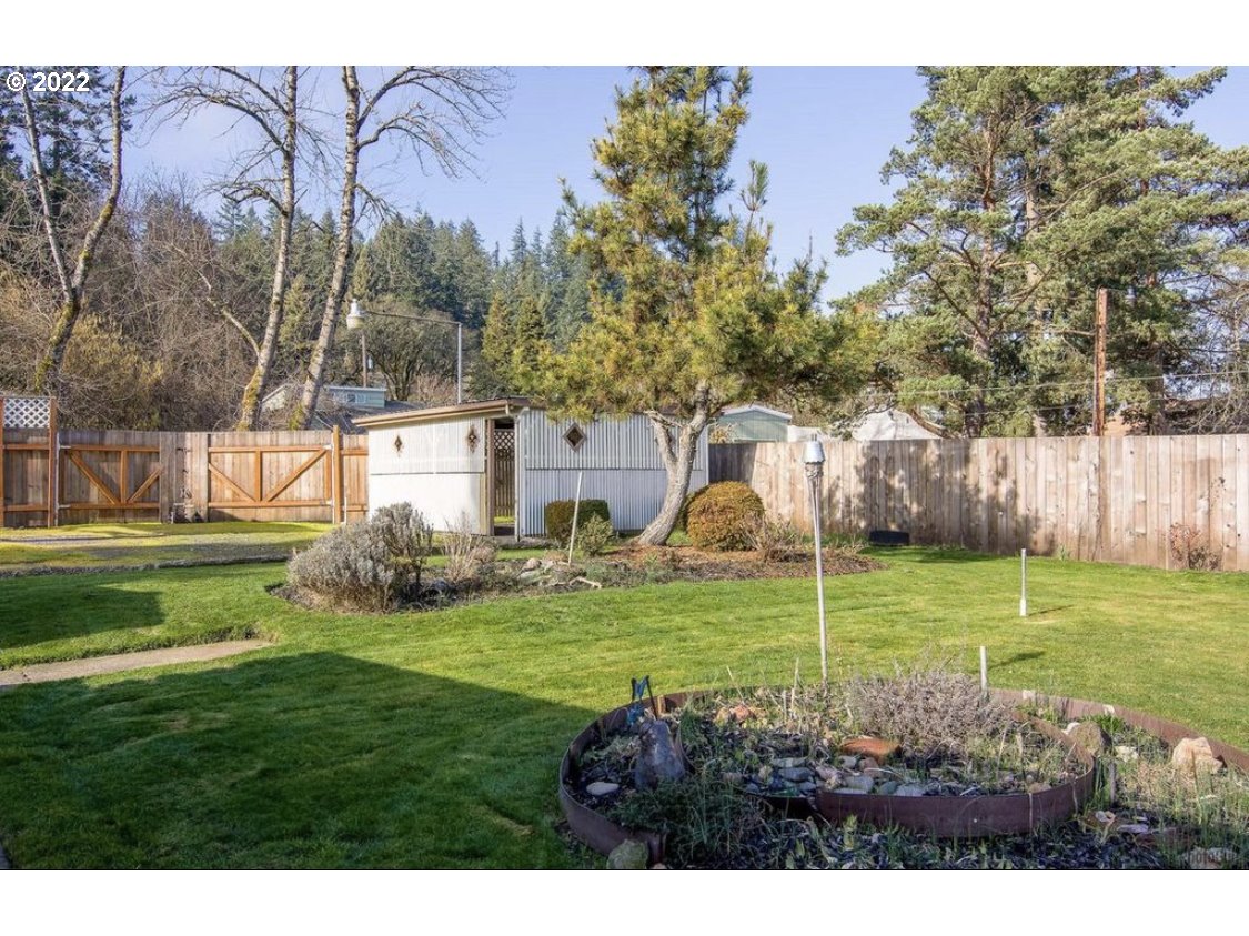 1648 Augusta Street Eugene, OR 97403 - Photo 25 of 29 a view of a house with a backyard