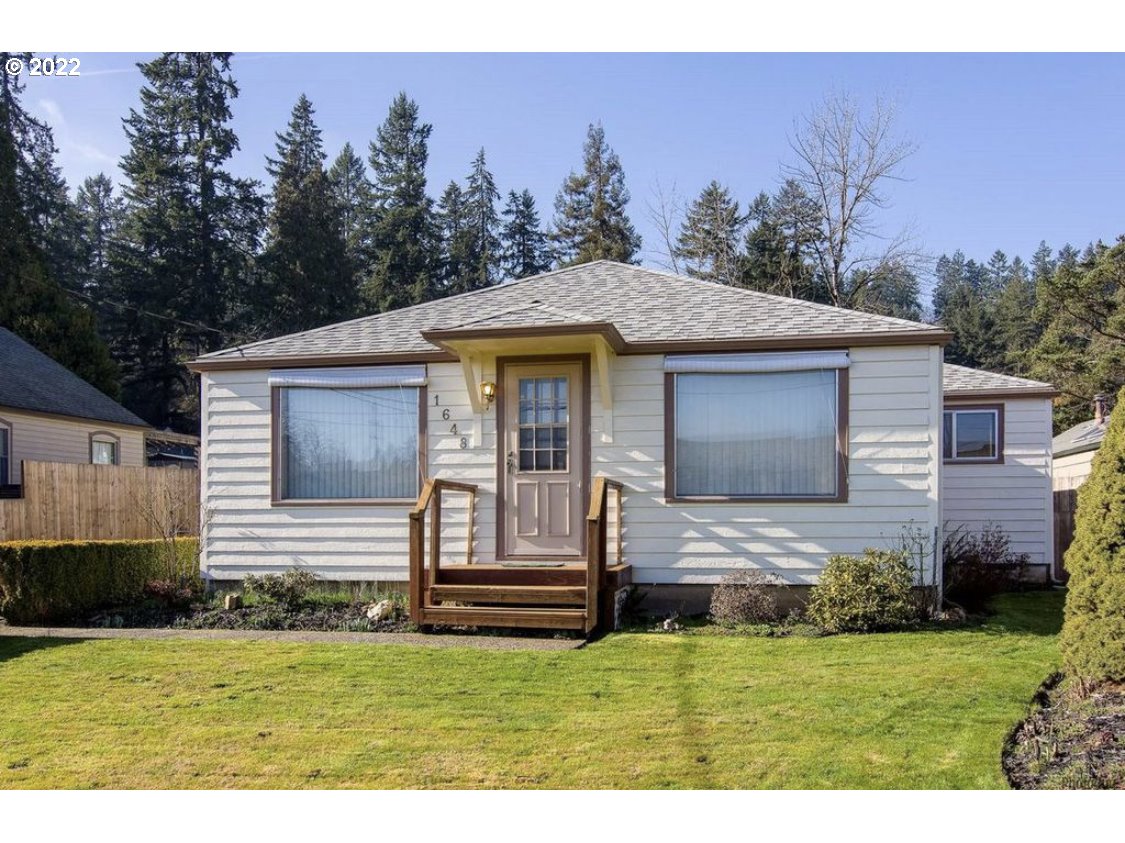 1648 Augusta Street Eugene, OR 97403 - Photo 29 of 29 a front view of a house with a garden