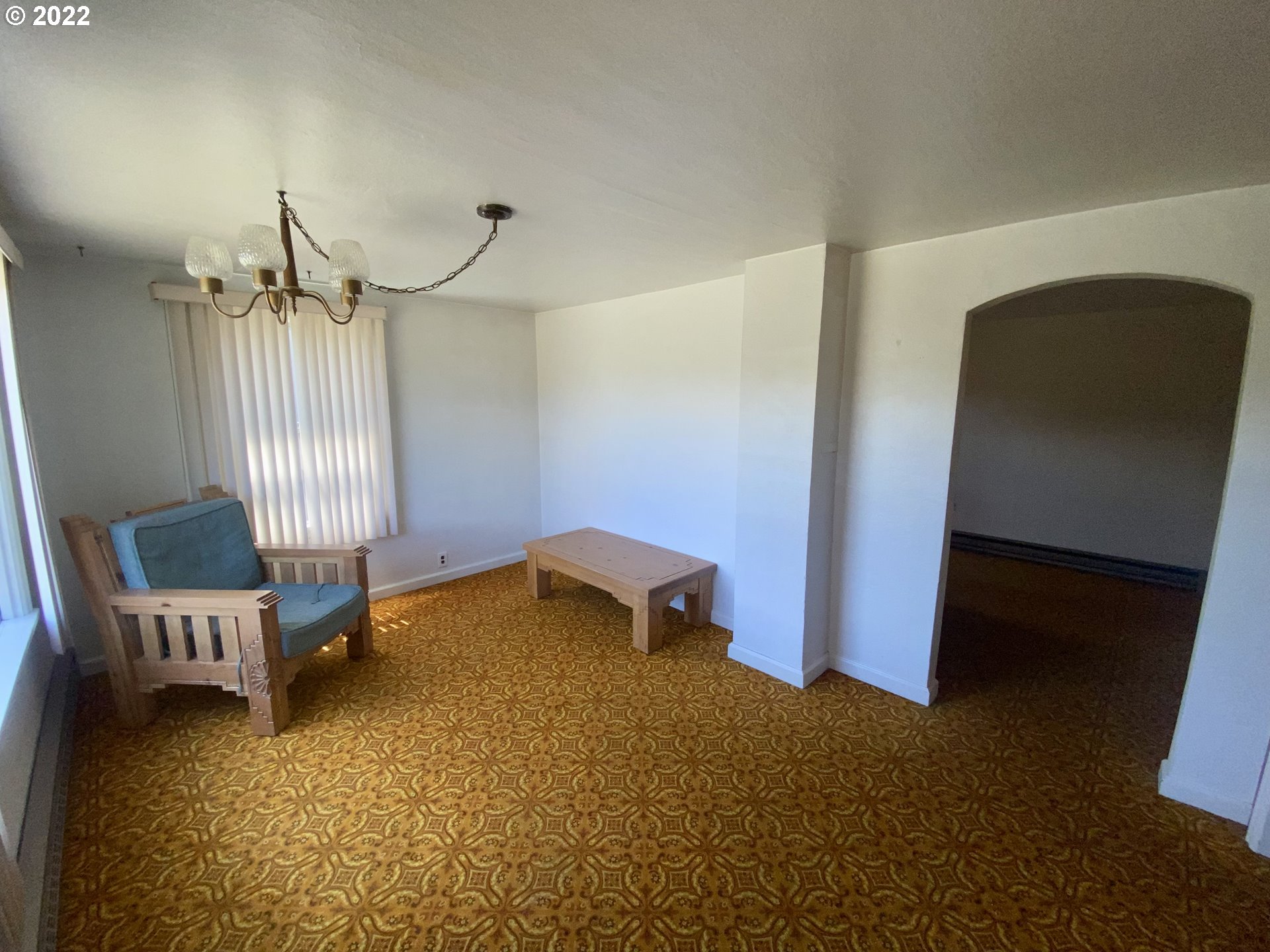 1648 Augusta Street Eugene, OR 97403 - Photo 4 of 29 a bedroom with a bed and a chair