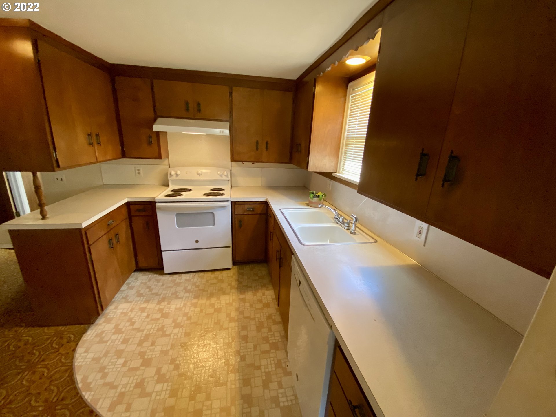 1648 Augusta Street Eugene, OR 97403 - Photo 6 of 29 a kitchen with a sink a stove and cabinets