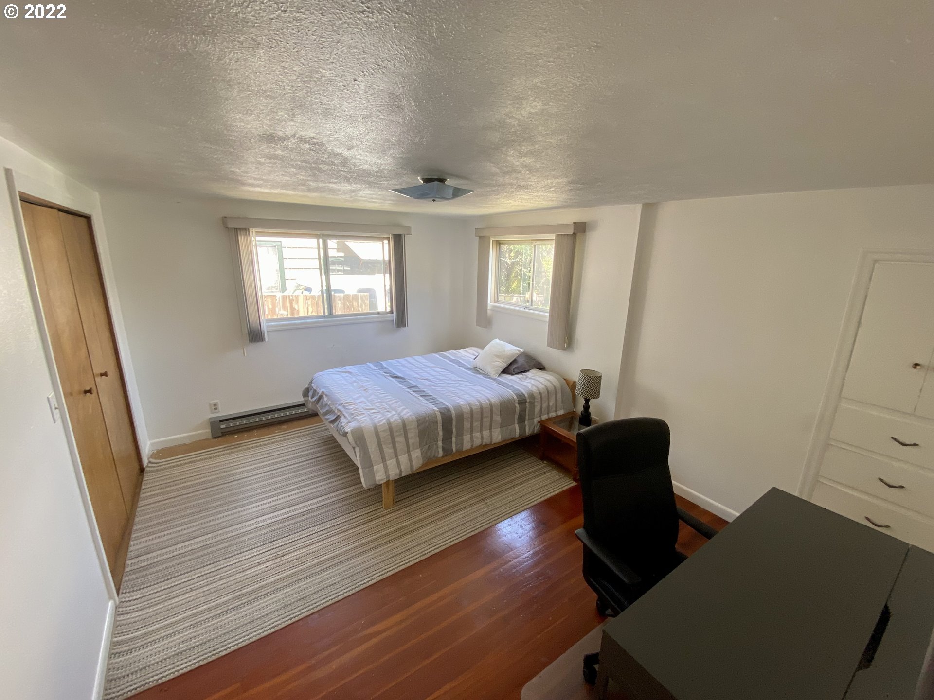 1648 Augusta Street Eugene, OR 97403 - Photo 9 of 29 a bedroom with a bed and a desk
