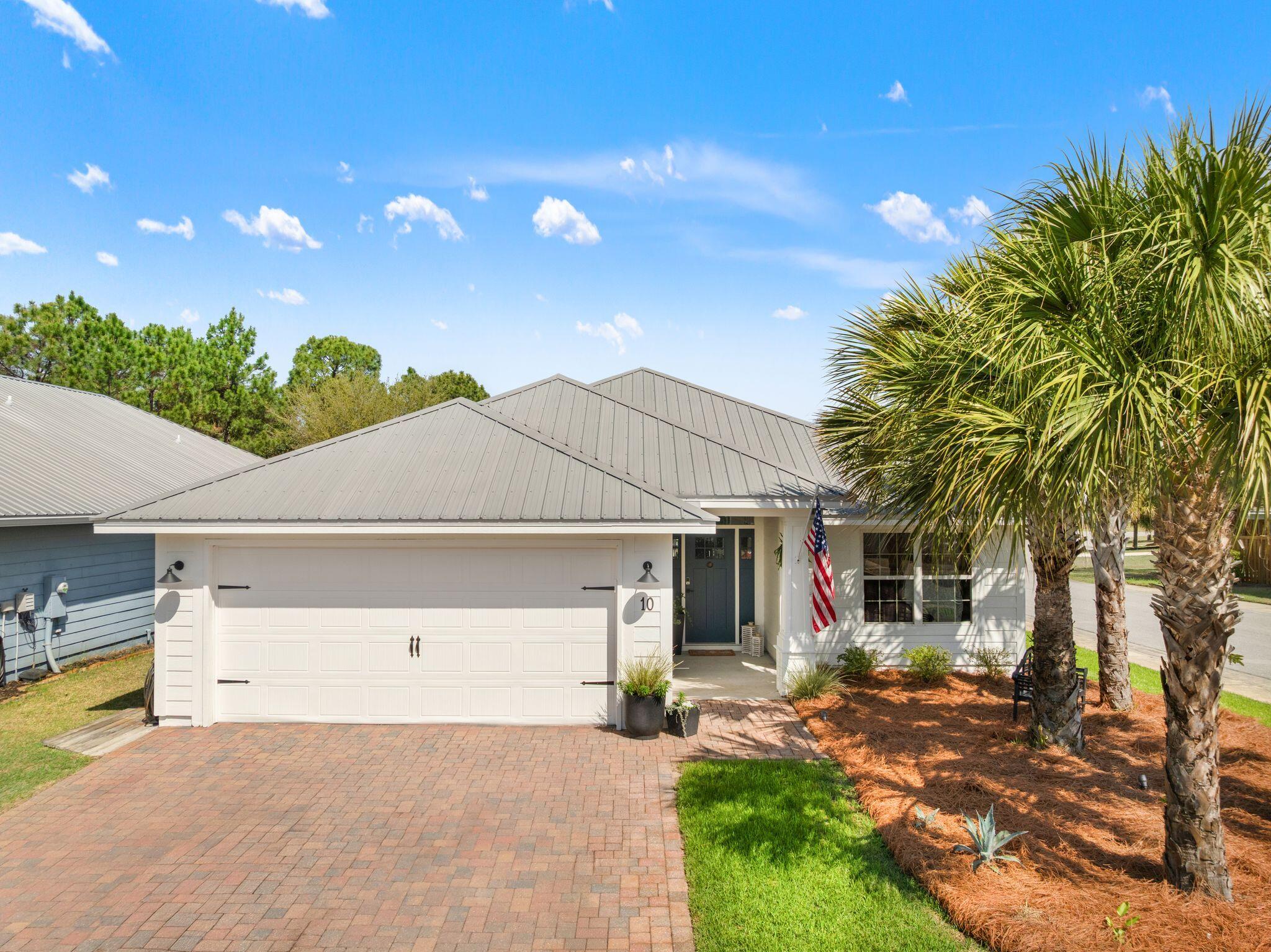 10 Golden Eagle Court Santa Rosa Beach, FL 32459 - Photo 3 of 36 a view of a house with a yard and garage