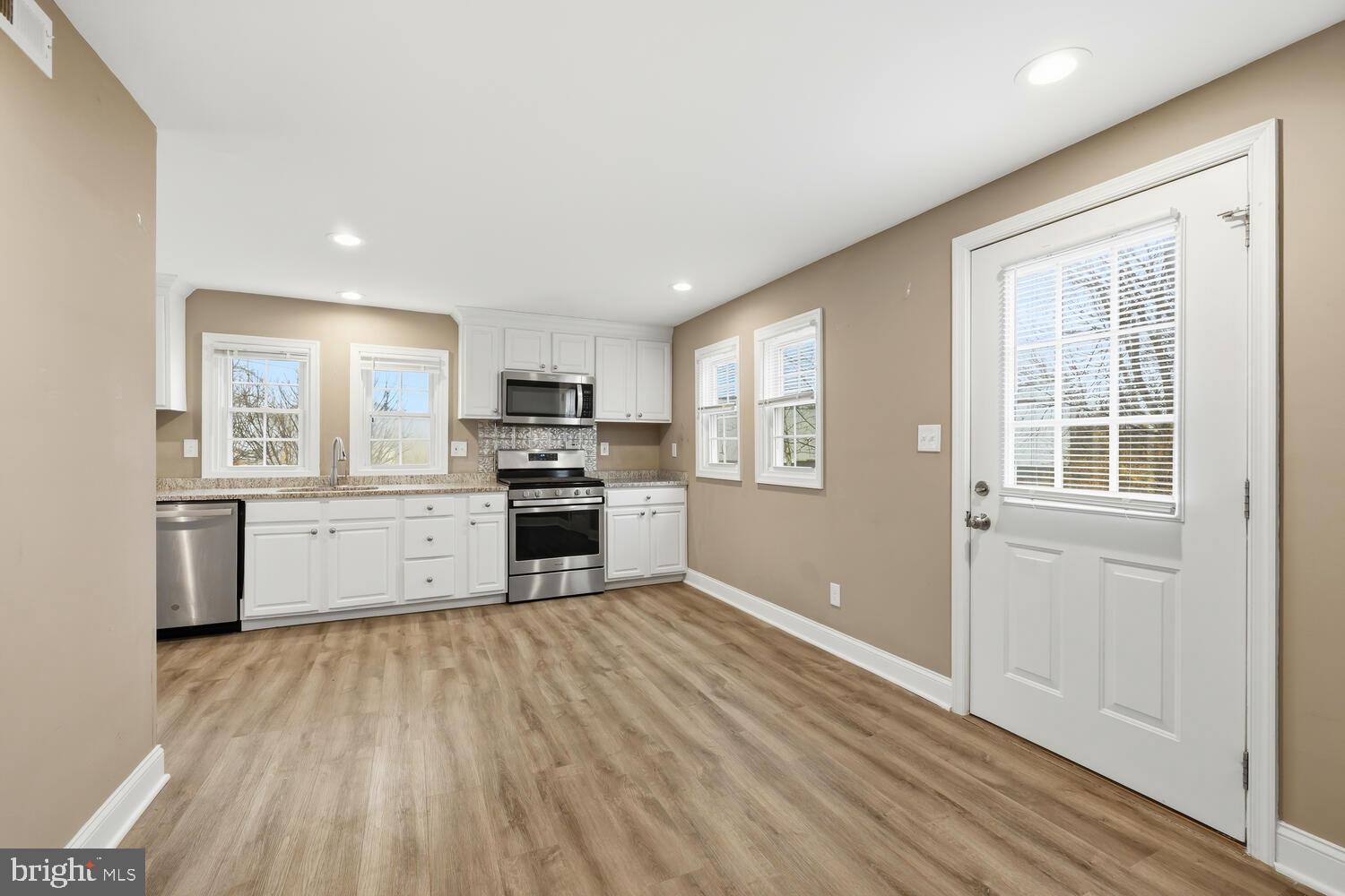 21524 Chicken Point Road Tilghman, MD 21671 - Photo 12 of 41 Kitchen with door leading to backyard