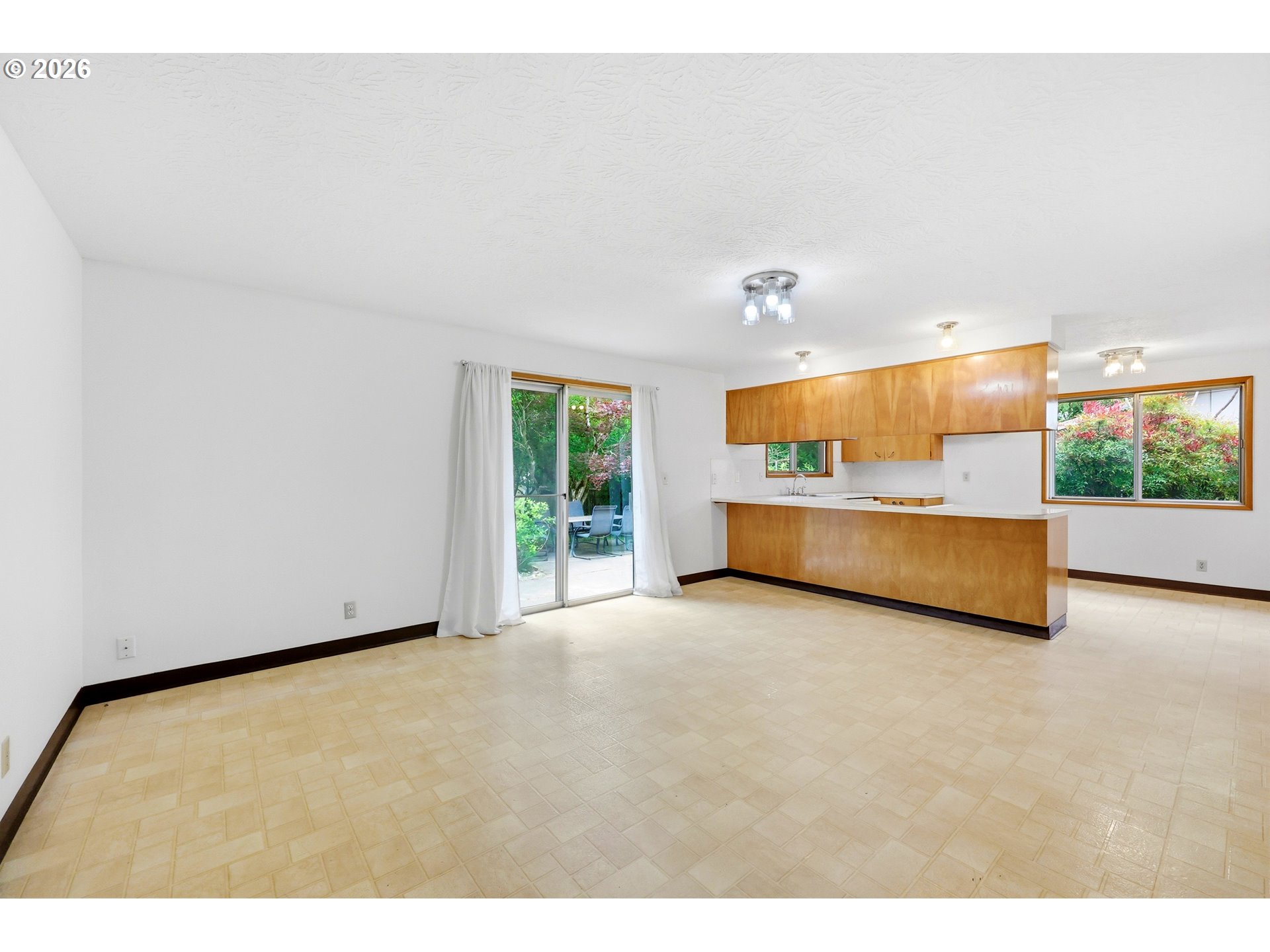 3003 Southeast 162nd Avenue Portland, OR 97236 - Photo 12 of 41 a view of an empty room with a window