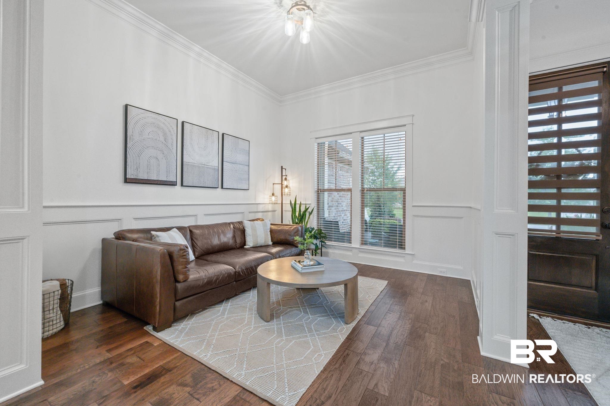 418 Fortune Drive Fairhope, AL 36532 - Photo 8 of 63 Living room featuring crown molding and dark hardwood / wood-style flooring