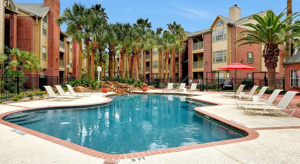 8300 El Mundo Street, Unit 192 Houston, TX 77054 - Photo 1 of 27 a view of swimming pool with outdoor seating and house in the background
