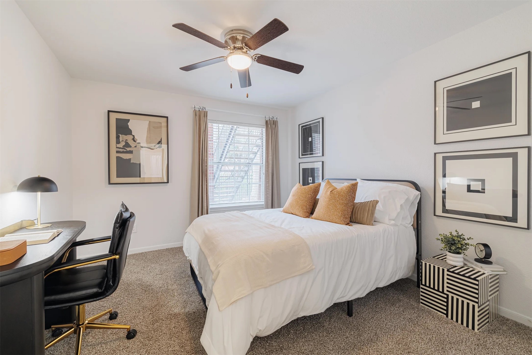 8300 El Mundo Street, Unit 192 Houston, TX 77054 - Photo 12 of 27 a bedroom with a bed and a chandelier