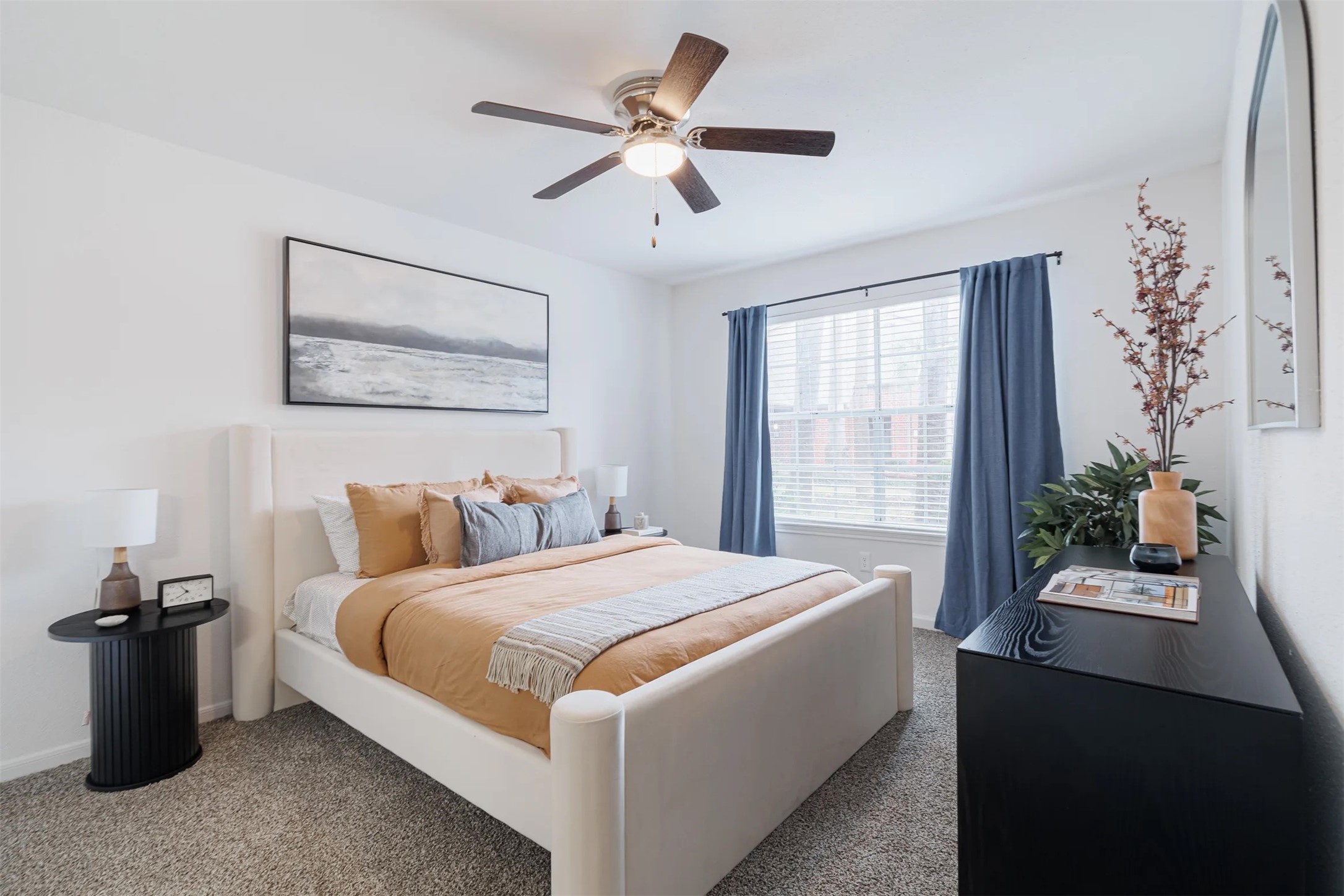 8300 El Mundo Street, Unit 192 Houston, TX 77054 - Photo 13 of 27 a bedroom with a bed and a chandelier