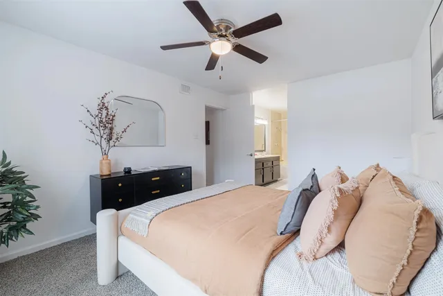 a bedroom with a bed and window