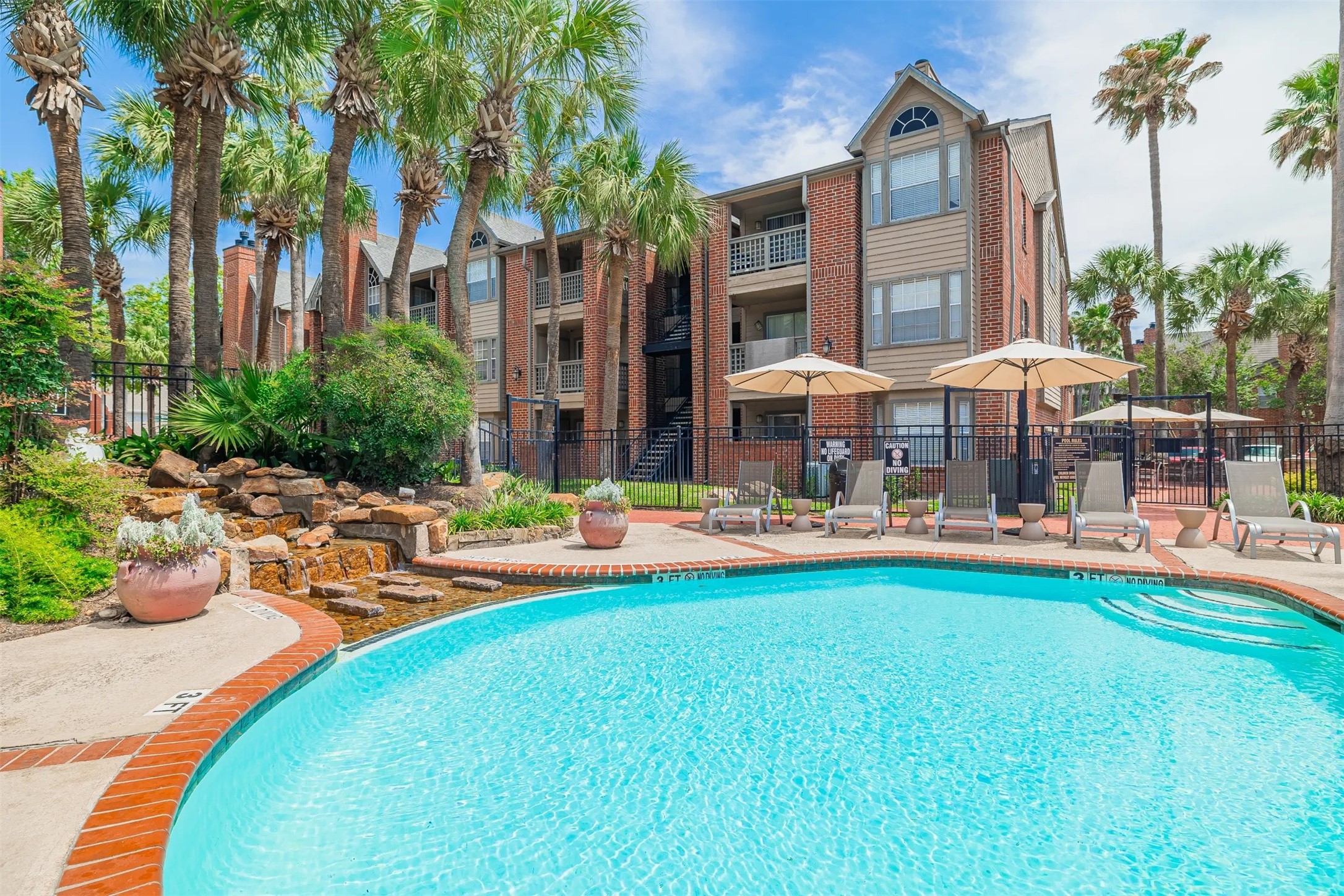 8300 El Mundo Street, Unit 192 Houston, TX 77054 - Photo 18 of 27 a view of a swimming pool with a patio and plants