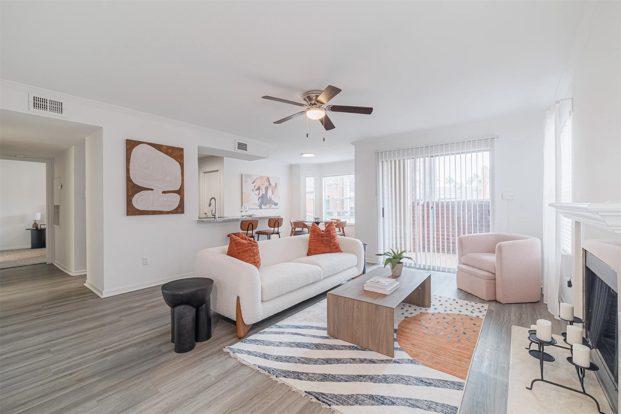8300 El Mundo Street, Unit 192 Houston, TX 77054 - Photo 2 of 27 a living room with furniture a rug and a chandelier