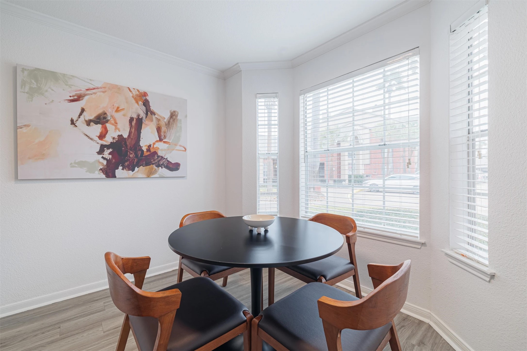 8300 El Mundo Street, Unit 192 Houston, TX 77054 - Photo 7 of 27 a view of a dining room with furniture and wooden floor