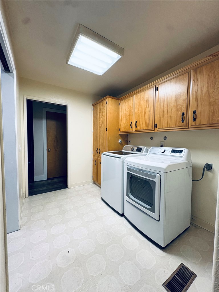 4728 Hartley Drive Forest Ranch, CA 95942 - Photo 11 of 33 a utility room with stainless steel appliances granite countertop a stove a sink and a microwave