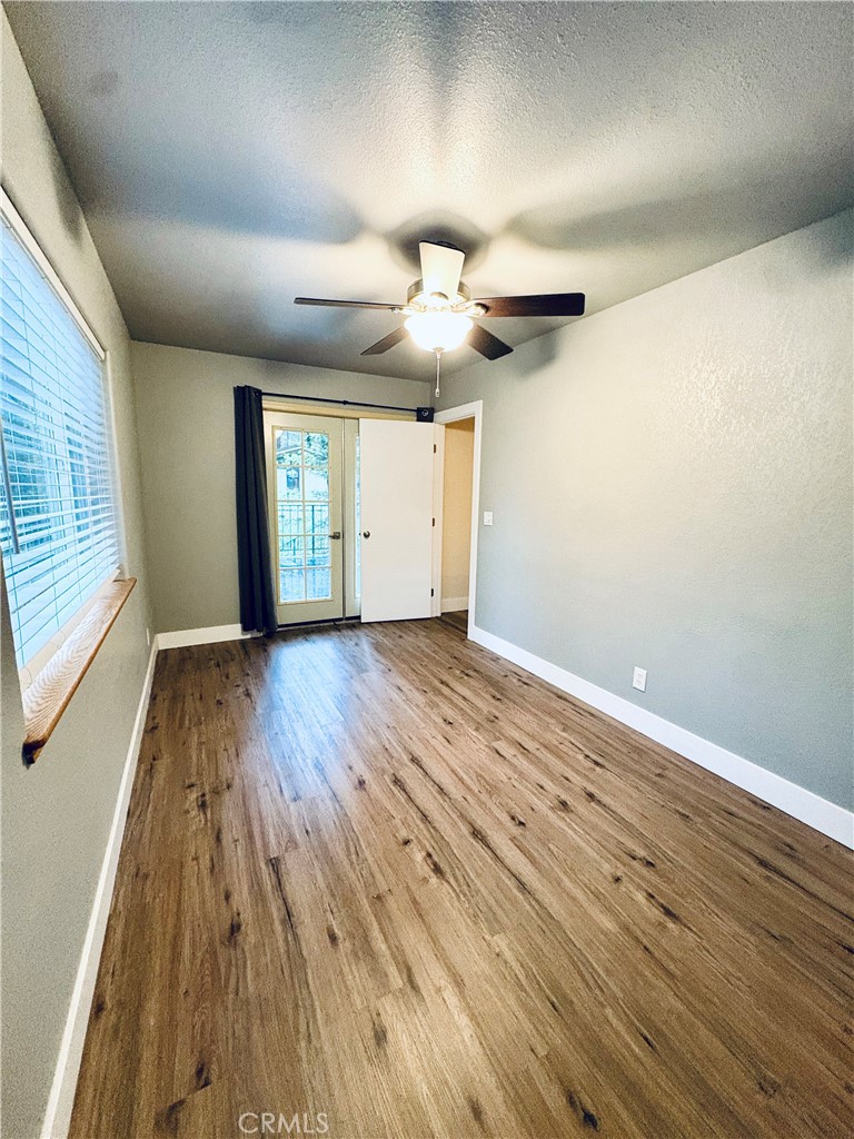 4728 Hartley Drive Forest Ranch, CA 95942 - Photo 13 of 33 wooden floor in an empty room with a window