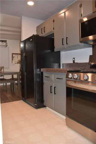 a kitchen with stainless steel appliances a stove and a refrigerator