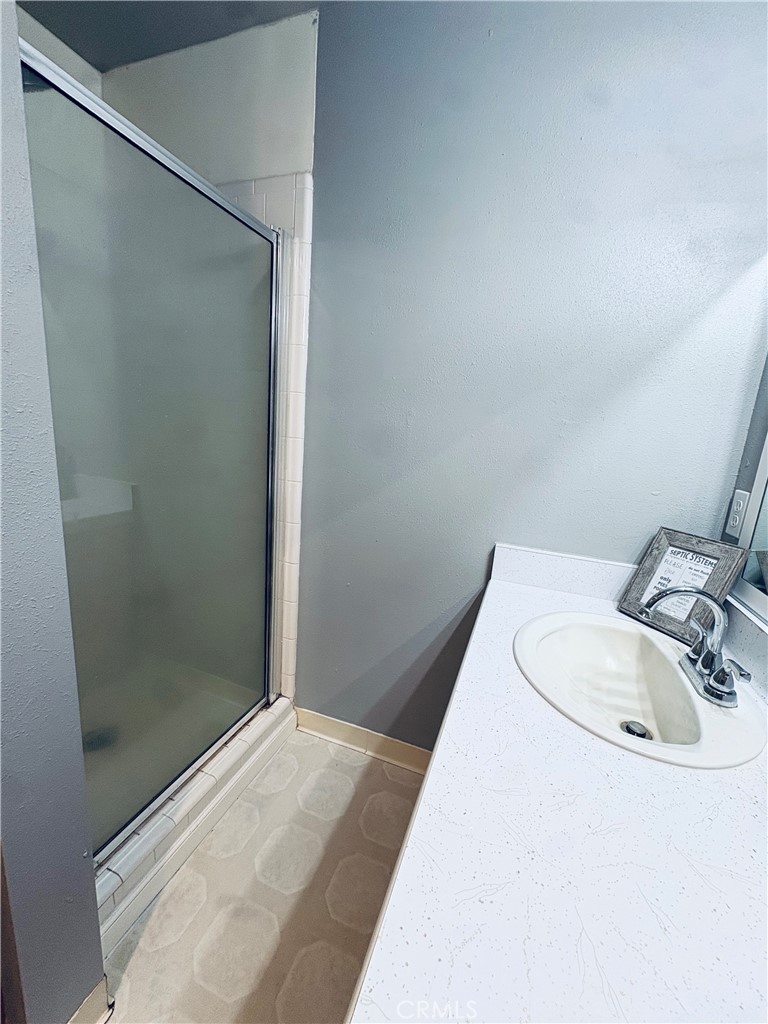 4728 Hartley Drive Forest Ranch, CA 95942 - Photo 20 of 33 a bathroom with a sink and shower