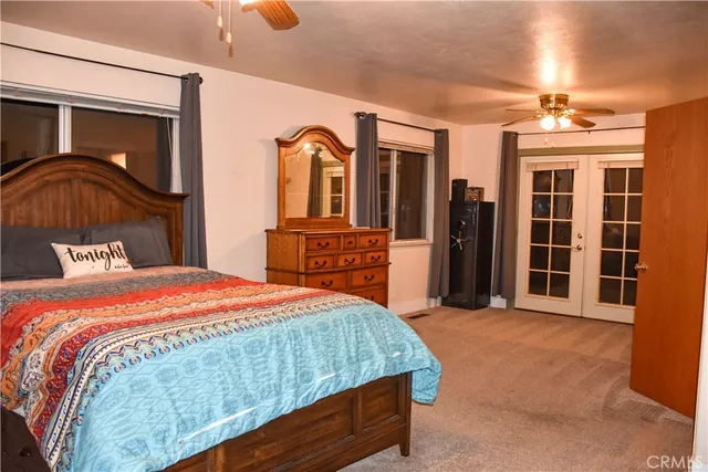 a bedroom with a bed and a view of bedroom