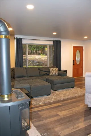 a living room with granite countertop furniture and a large window