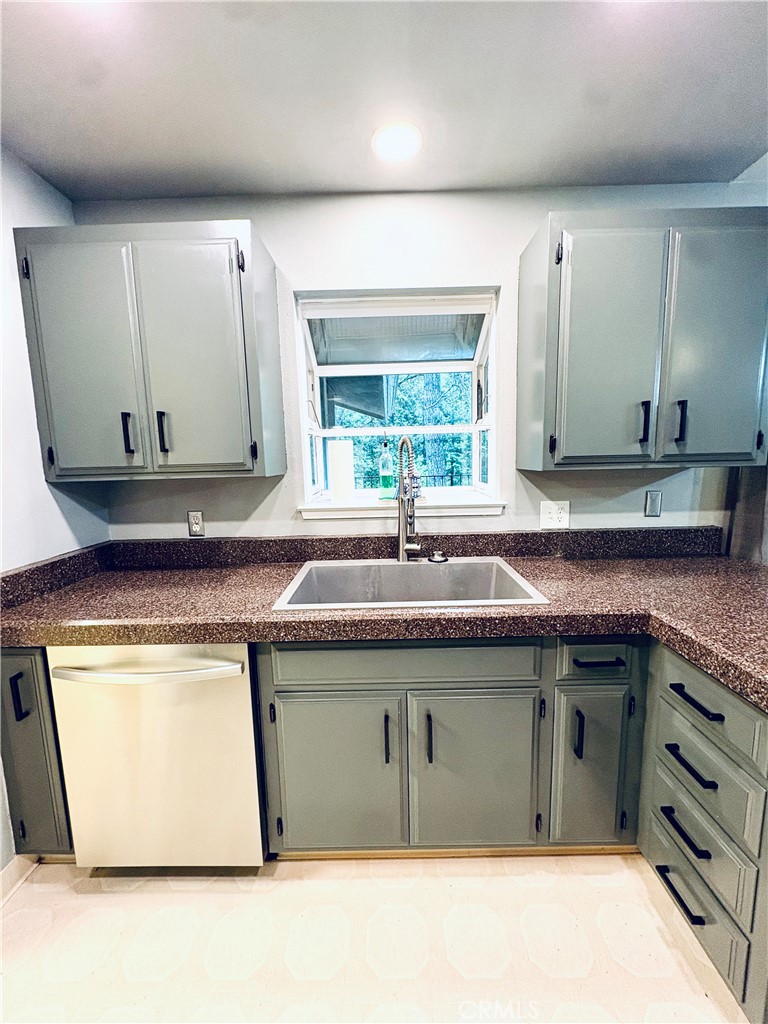 4728 Hartley Drive Forest Ranch, CA 95942 - Photo 10 of 33 a kitchen with stainless steel appliances granite countertop a sink and a microwave