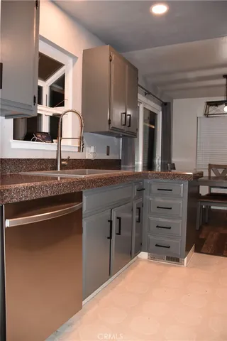 a kitchen with a sink and cabinets