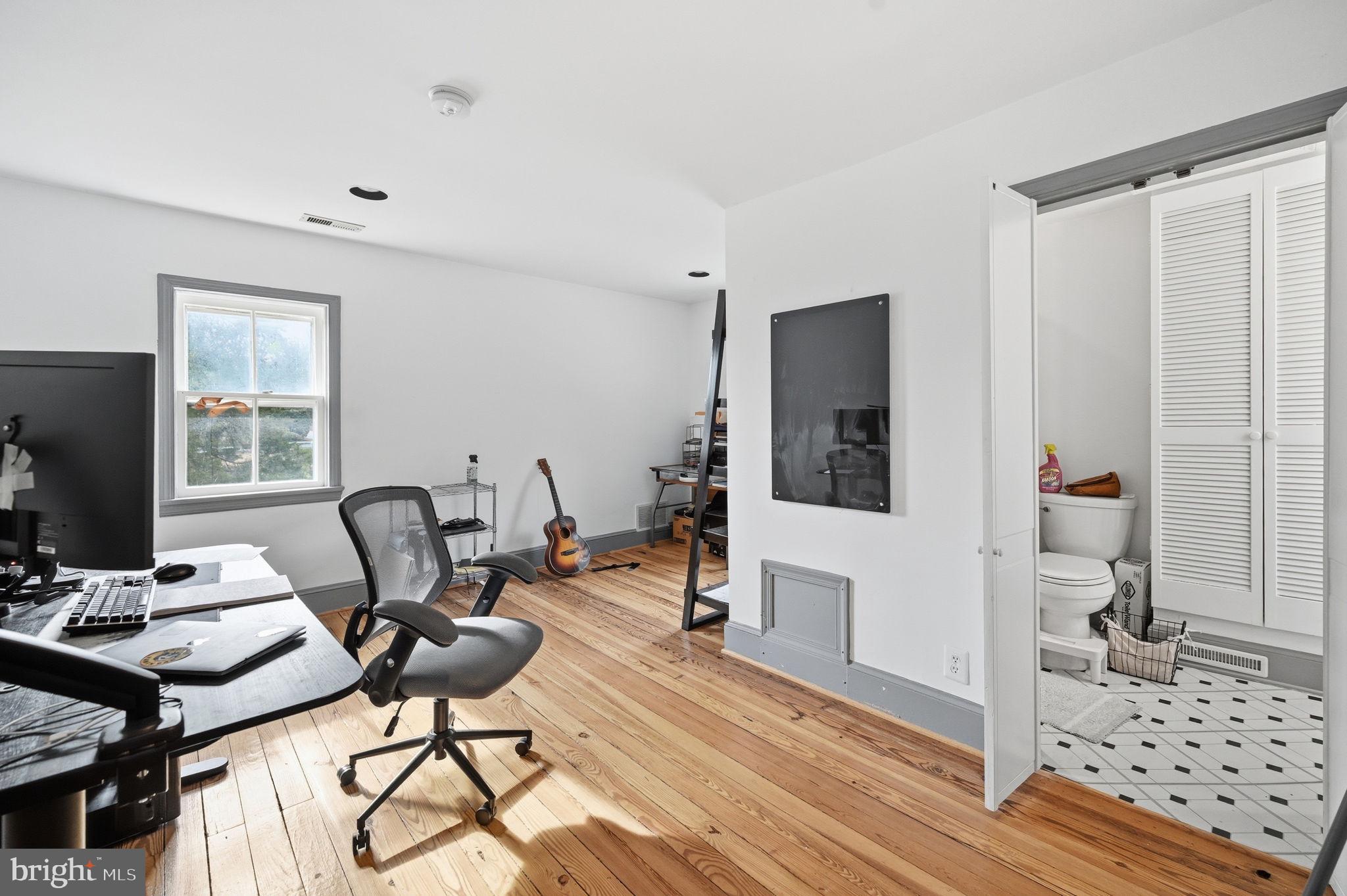 11641 Glen Road Potomac, MD 20854 - Photo 21 of 40 a view of a workspace with furniture and a window