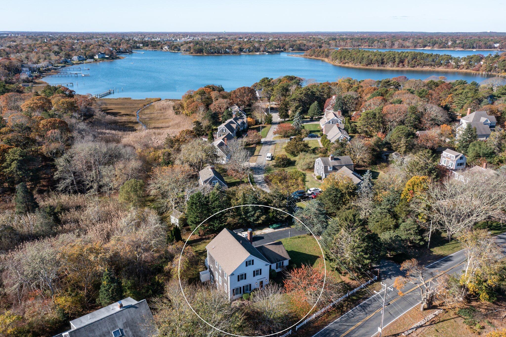 3 Pinefield Lane South Dennis, MA 02660 - Photo 1 of 51 an aerial view of a house with a lake view
