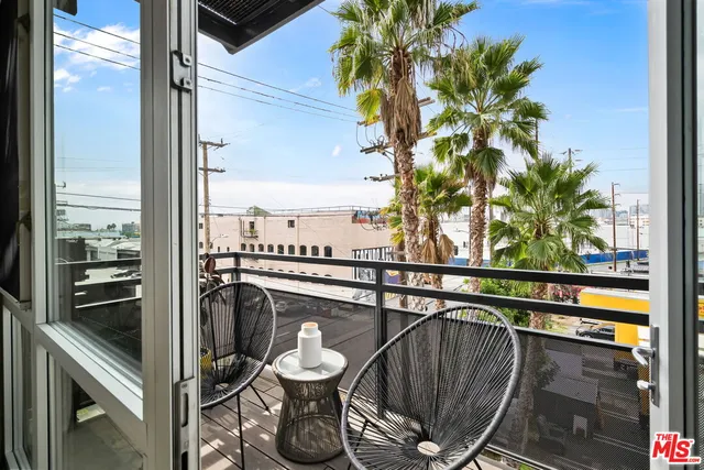 a view of a balcony with chairs
