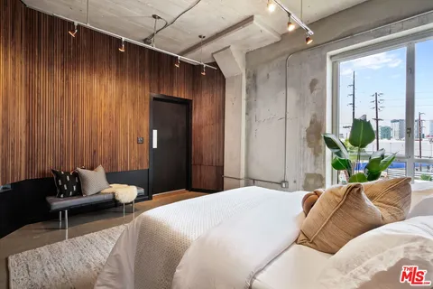 a bedroom with a bed and window