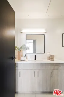 a bedroom with a bed and a washer dryer