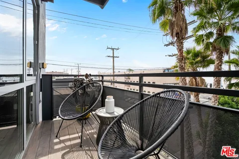 a view of a balcony dining area