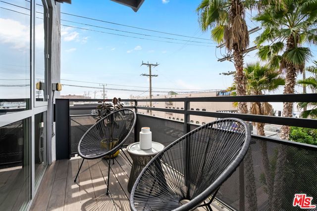 a view of a balcony dining area