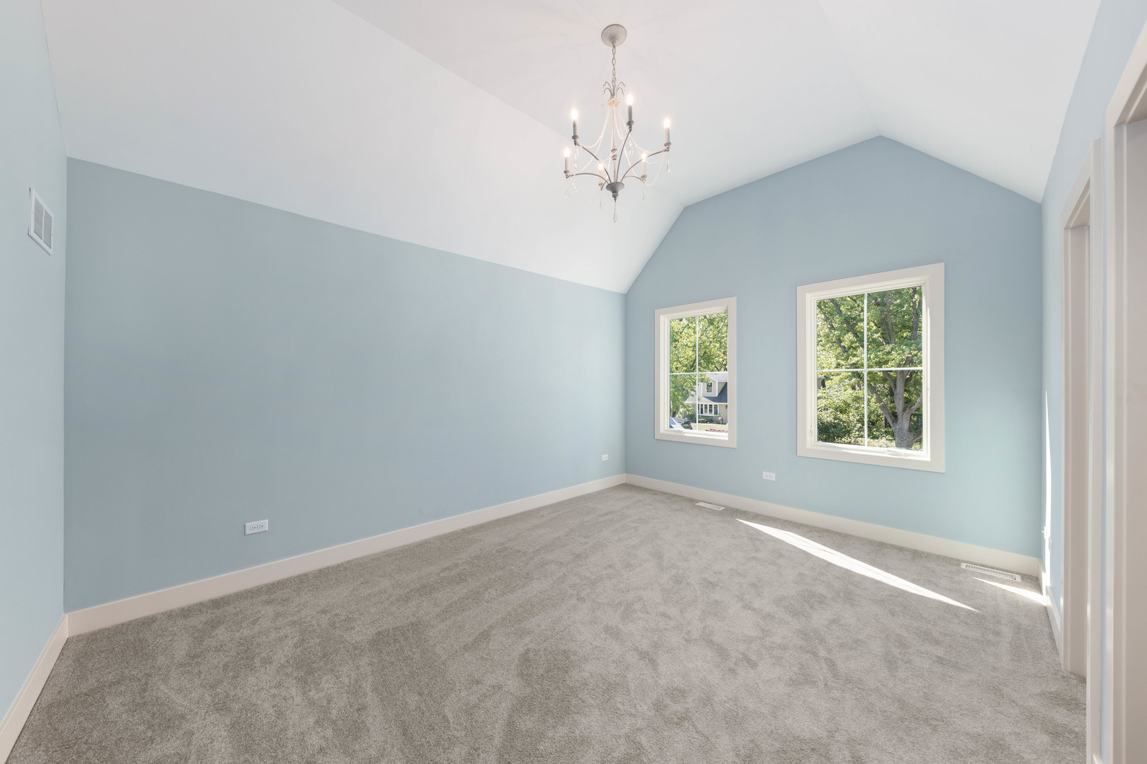 1314 Eagle Street Naperville, IL 60563 - Photo 17 of 28 an empty room with windows and chandelier