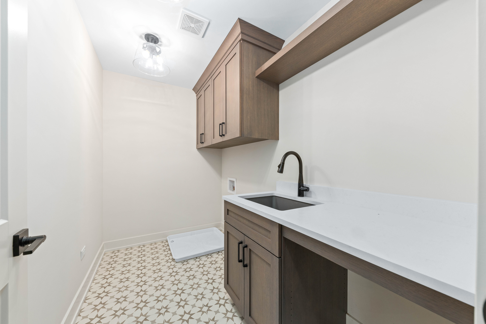 1314 Eagle Street Naperville, IL 60563 - Photo 19 of 28 a view of a bathroom with a sink and a mirror