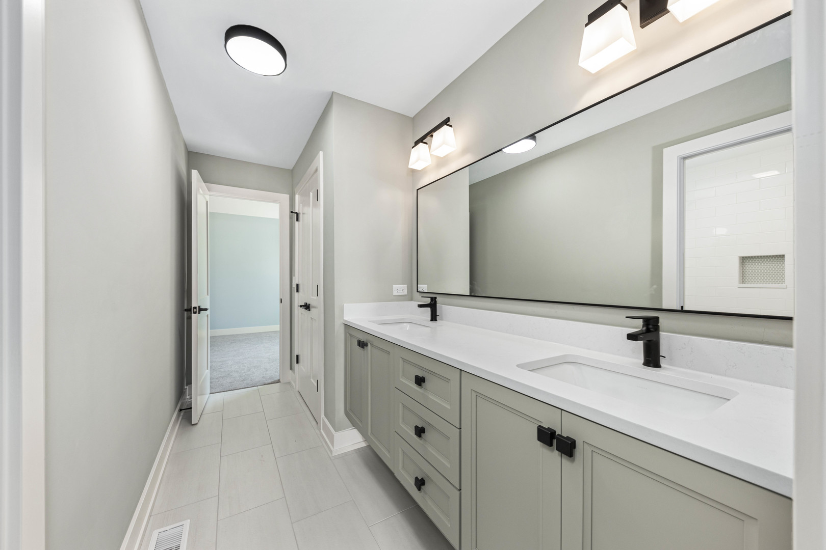 1314 Eagle Street Naperville, IL 60563 - Photo 22 of 28 a bathroom with a double vanity sink and mirror