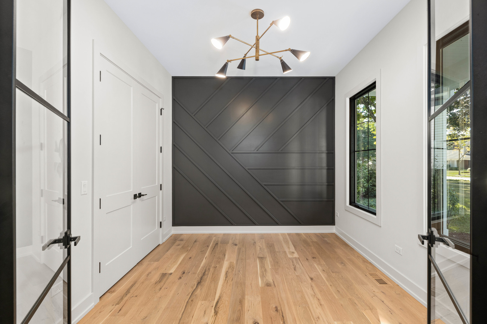 1314 Eagle Street Naperville, IL 60563 - Photo 4 of 28 a view of a hallway with wooden floor and staircase