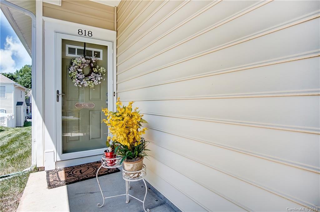 818 Gentlewinds Court Fort Mill, SC 29708 - Photo 2 of 22 a potted plant sitting in front of a door