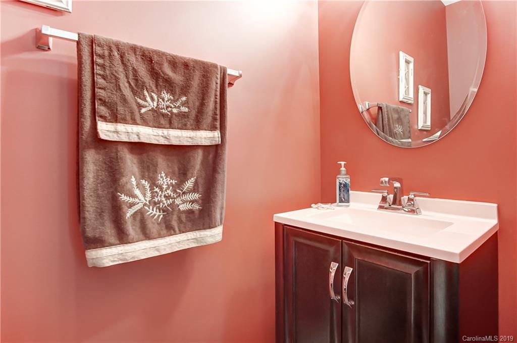 818 Gentlewinds Court Fort Mill, SC 29708 - Photo 14 of 22 a bathroom with a sink and a mirror